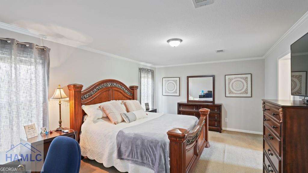 876 Hires Road Jesup, GA 31545 - Photo 15 of 30 a bedroom with a bed and dresser