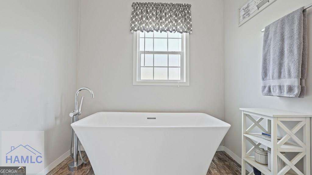 876 Hires Road Jesup, GA 31545 - Photo 18 of 30 a white bath tub sitting next to a window