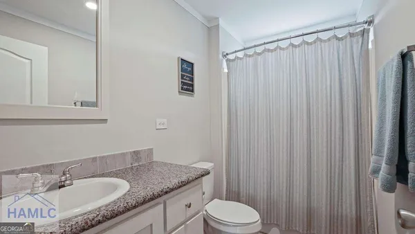 a front view of house with yard and trees