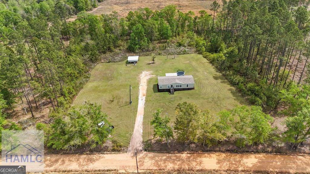 876 Hires Road Jesup, GA 31545 - Photo 3 of 30 a view of a yard with plants