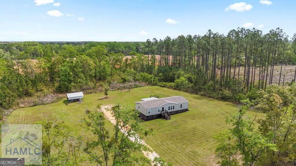 876 Hires Road Jesup, GA 31545 - Photo 5 of 30 a garden view with a lake view