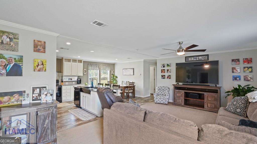 876 Hires Road Jesup, GA 31545 - Photo 8 of 30 a living room with furniture and a flat screen tv