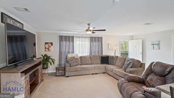 a kitchen with refrigerator cabinets and furniture