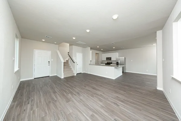 a view of kitchen with wooden floor and window