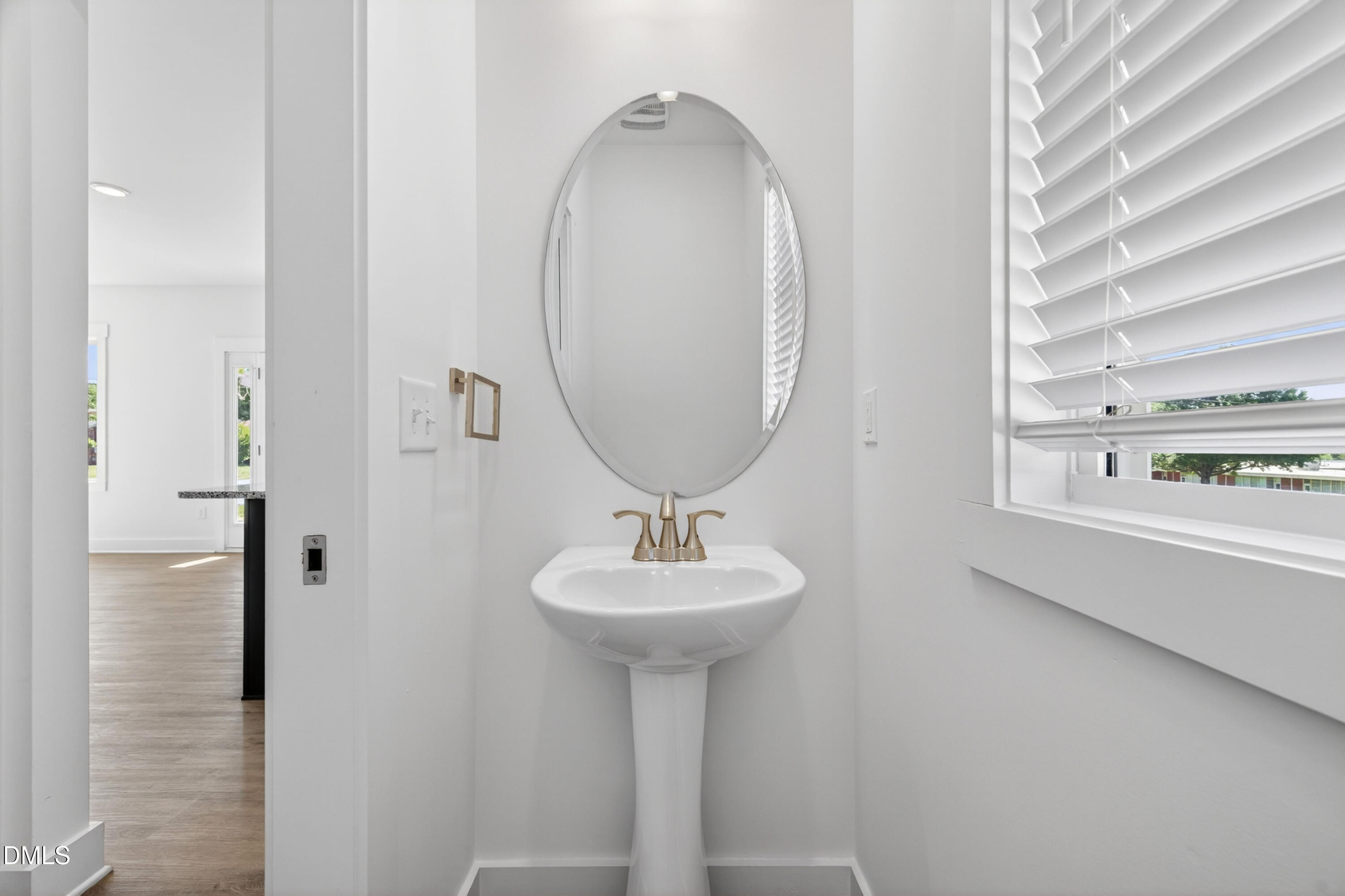 1238 Hurdle Mills Road Roxboro, NC 27573 - Photo 24 of 50 a bathroom with a sink a mirror and a window