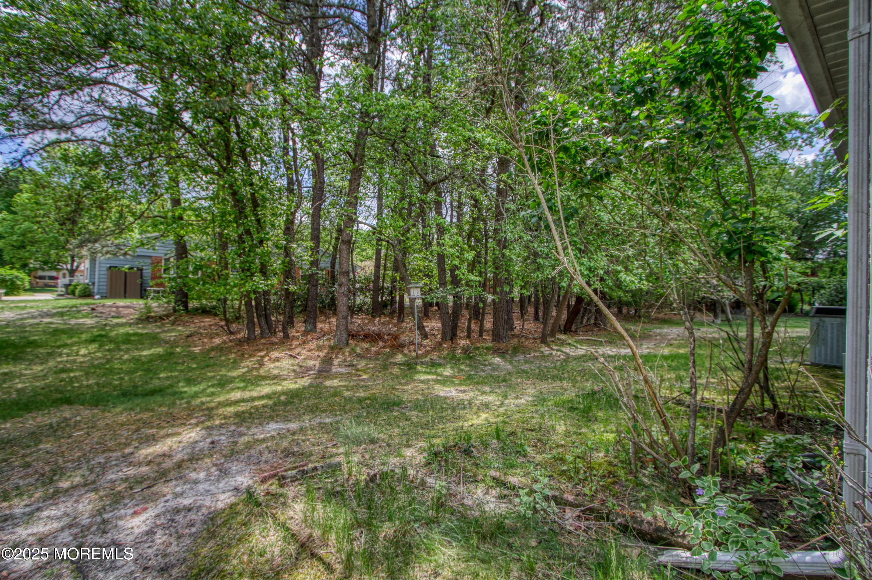 18 Moccasin Drive, Unit D Whiting, NJ 08759 - Photo 14 of 15 a view of outdoor space and yard