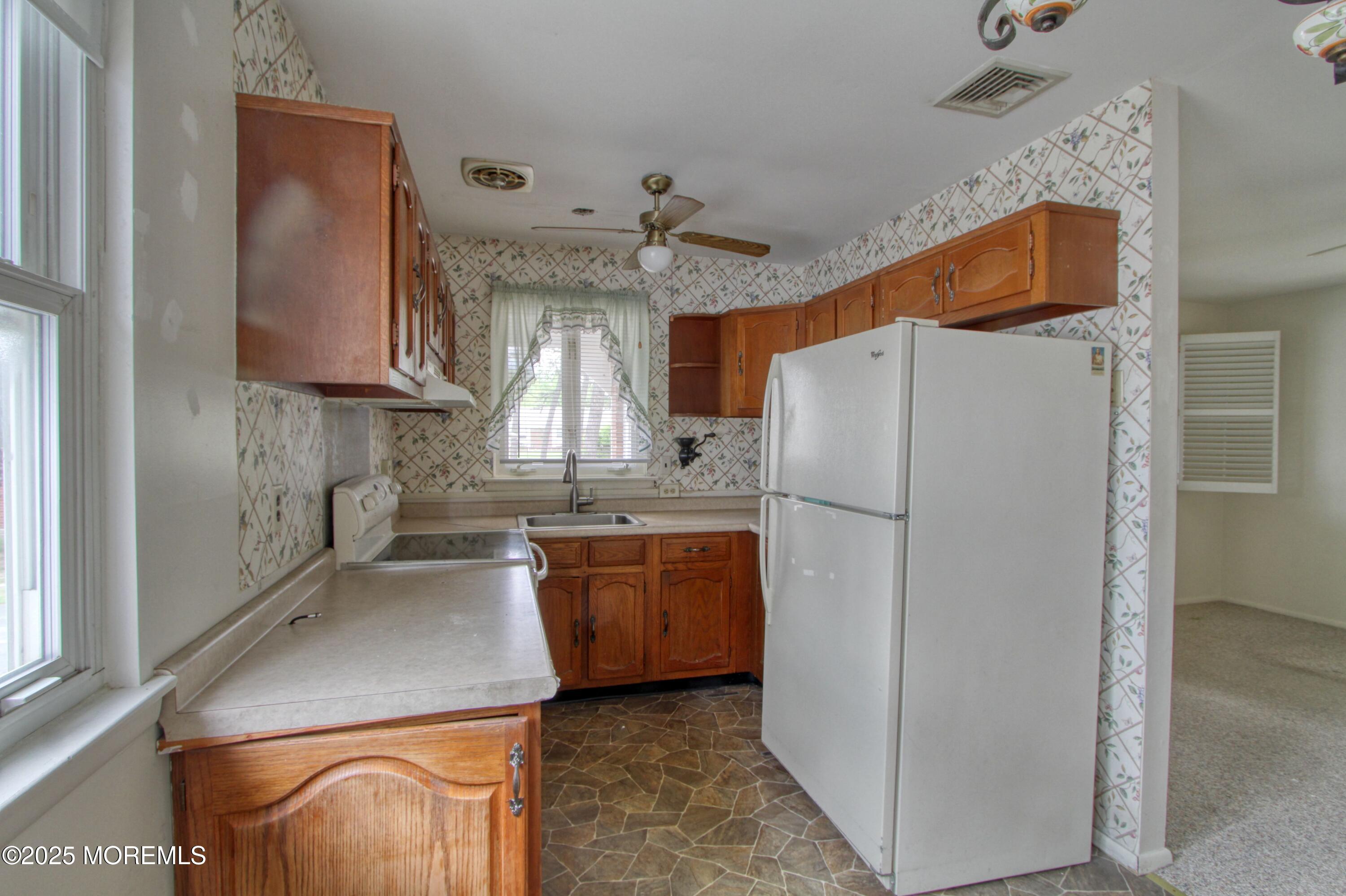 18 Moccasin Drive, Unit D Whiting, NJ 08759 - Photo 2 of 15 a kitchen with stainless steel appliances granite countertop a refrigerator a sink and a stove