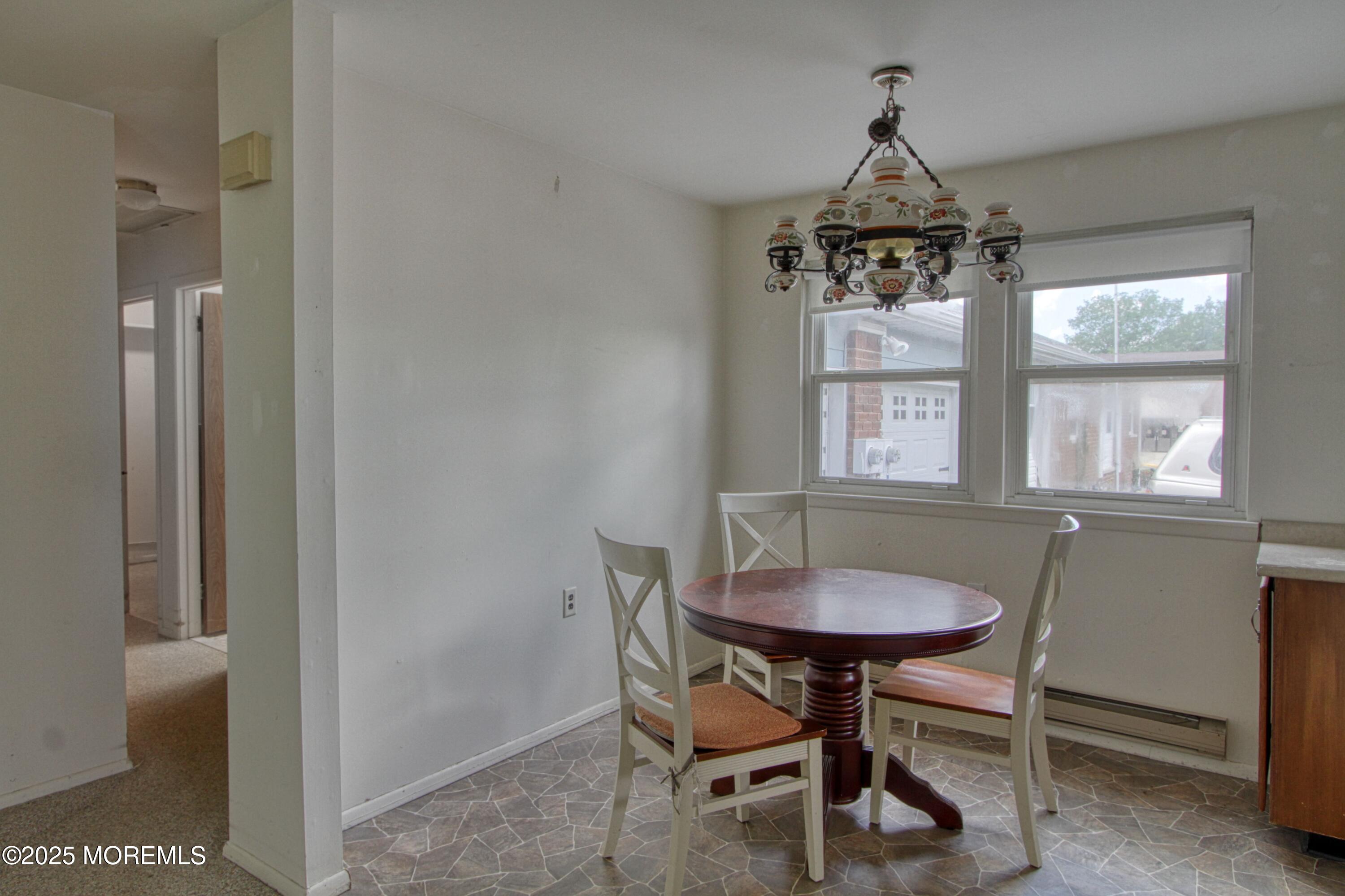 18 Moccasin Drive, Unit D Whiting, NJ 08759 - Photo 3 of 15 a dining room with furniture and window