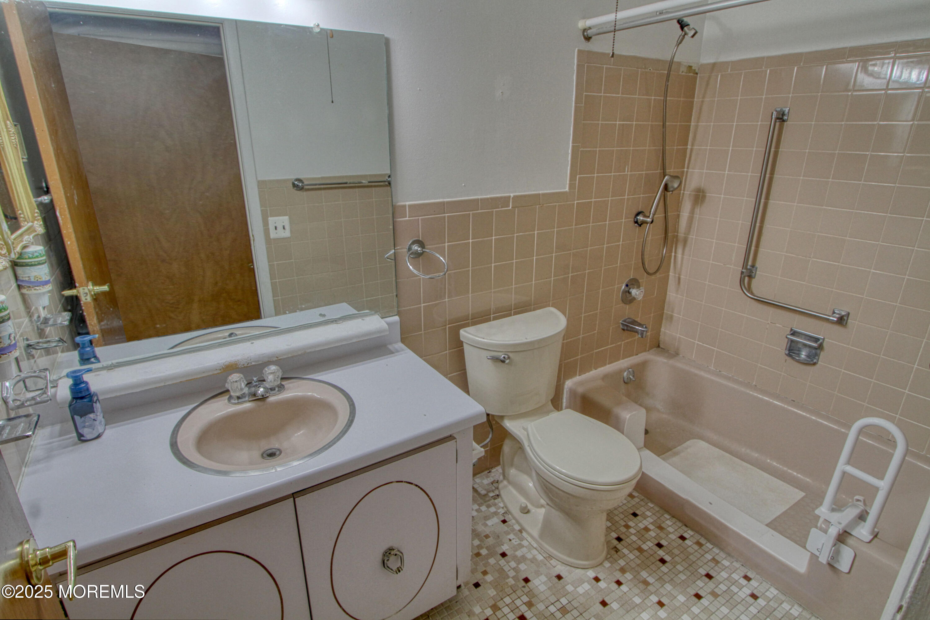 18 Moccasin Drive, Unit D Whiting, NJ 08759 - Photo 6 of 15 a bathroom with a sink a toilet and shower