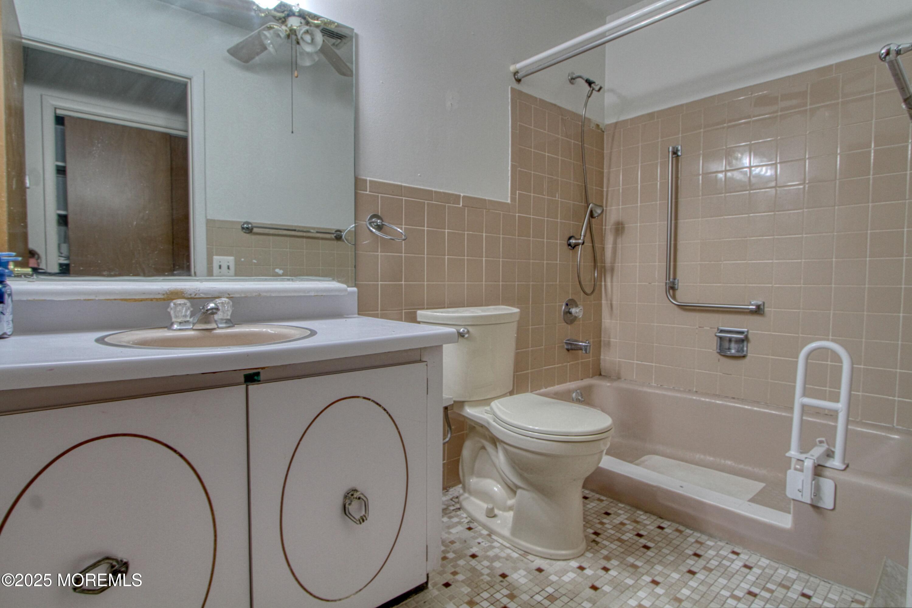 18 Moccasin Drive, Unit D Whiting, NJ 08759 - Photo 9 of 15 a bathroom with a sink toilet and shower