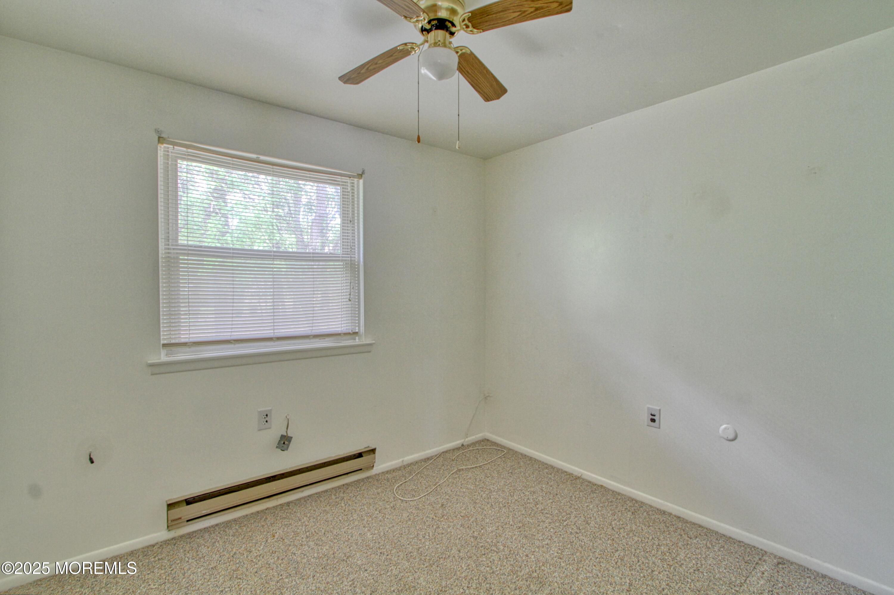 18 Moccasin Drive, Unit D Whiting, NJ 08759 - Photo 10 of 15 a view of an empty room with a window