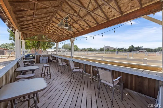 a view of a house with swimming pool and sitting area