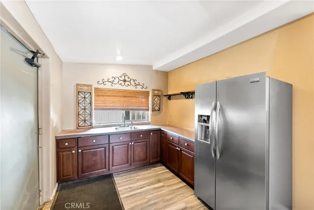 a kitchen with stainless steel appliances granite countertop a stove and a refrigerator