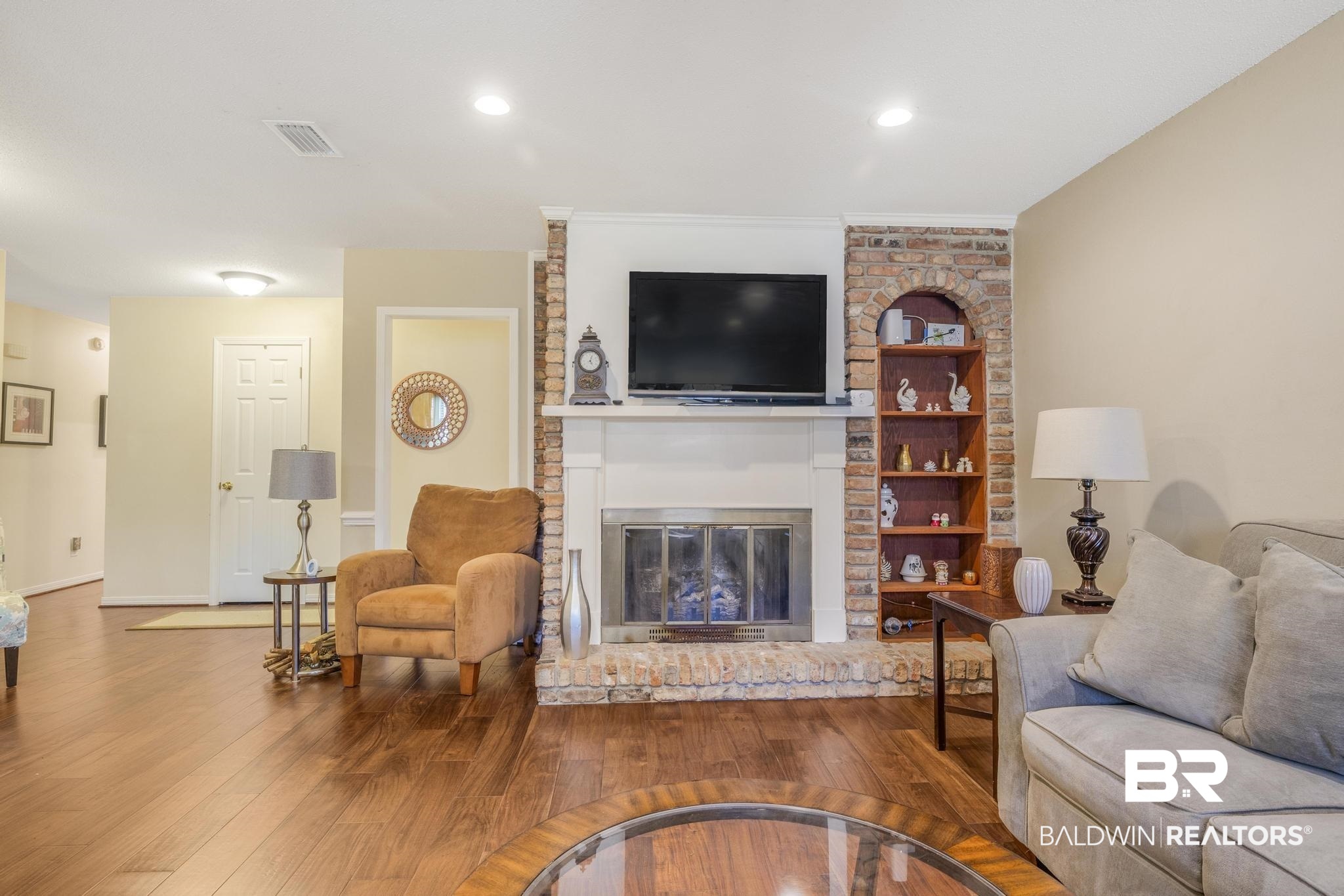 2573 E Road Mobile, AL 36693 - Photo 10 of 45 Living area featuring wood finished floors, a fireplace, and recessed lighting