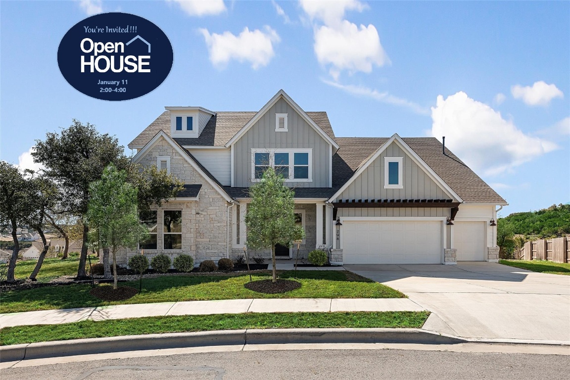 a front view of a house with a garden and garage