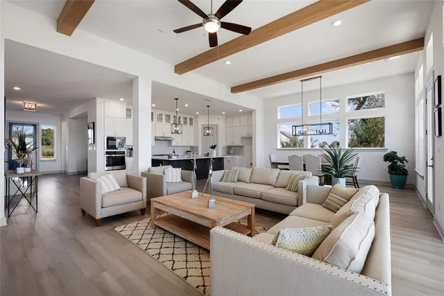 a living room with furniture potted plant and a fireplace