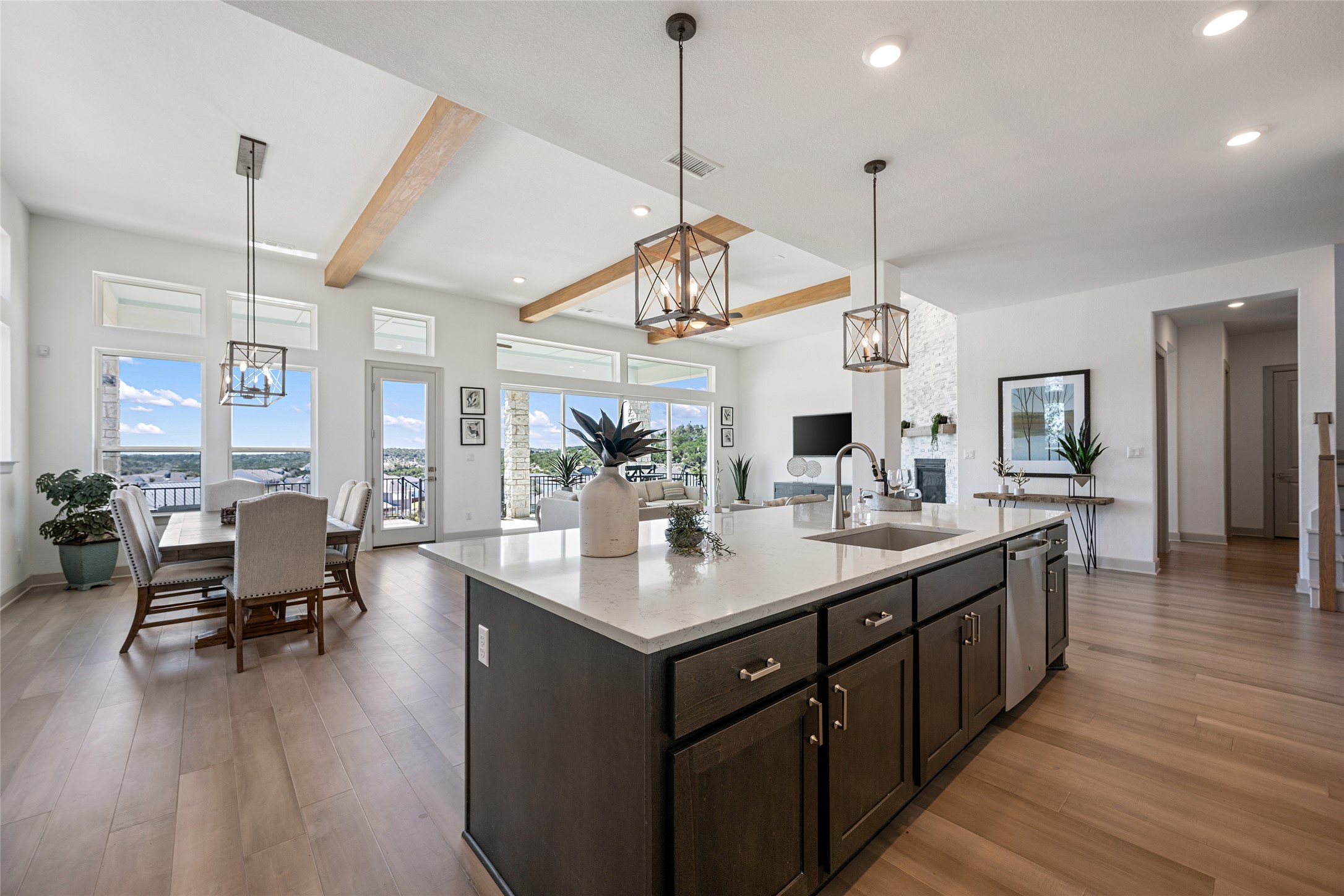 298 Smoke Tree Circle Dripping Springs, TX 78620 - Photo 38 of 38 a kitchen with sink stove and wooden floor