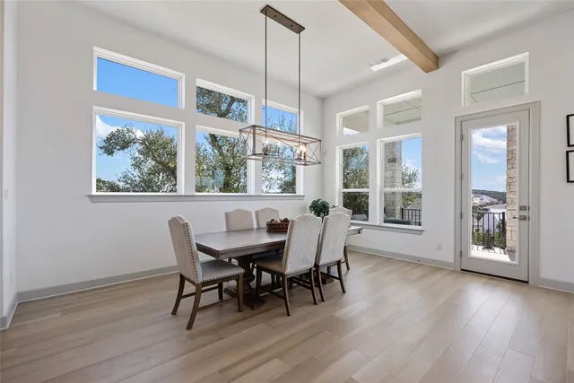 a kitchen with kitchen island granite countertop a sink a center island stainless steel appliances and cabinets