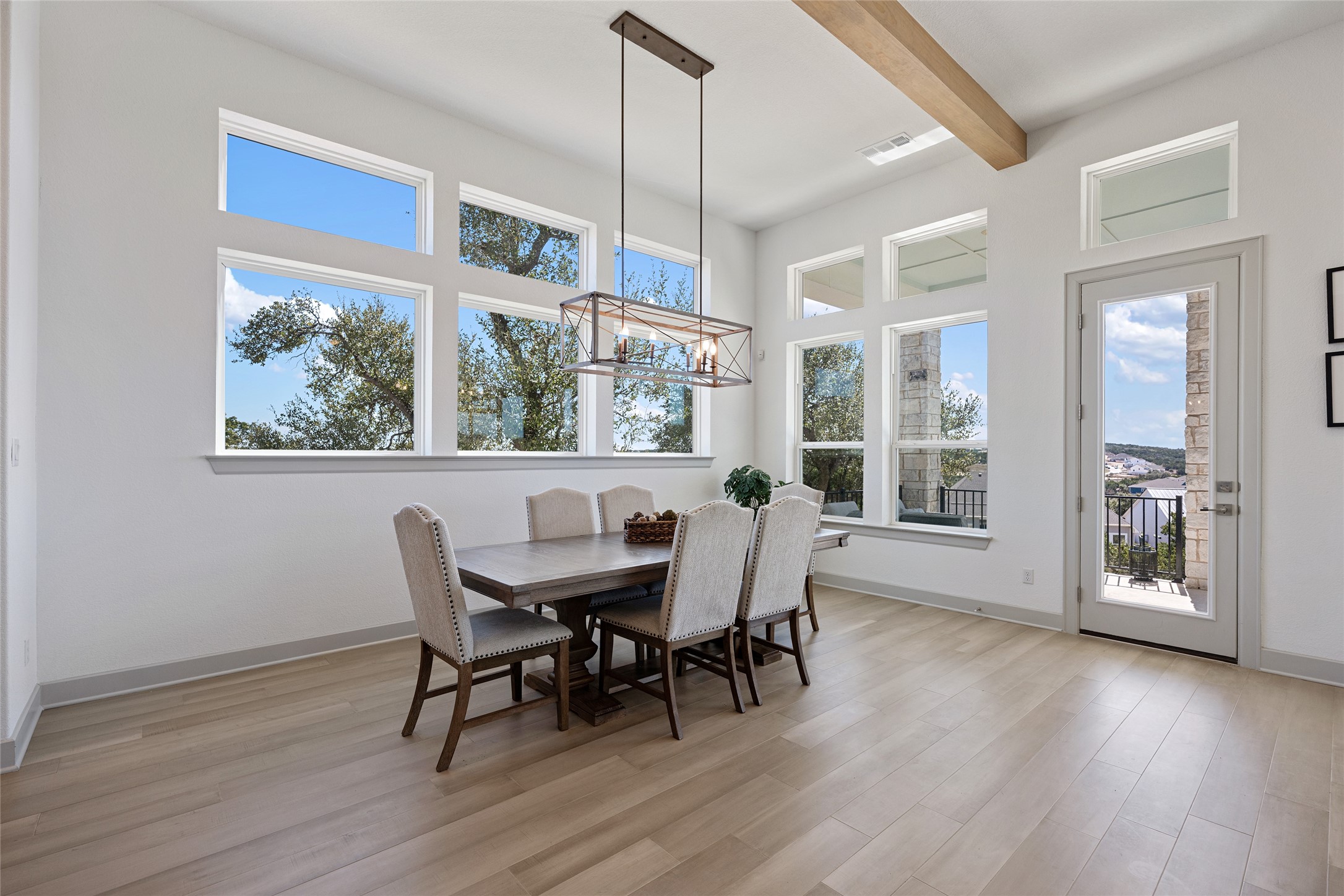 298 Smoke Tree Circle Dripping Springs, TX 78620 - Photo 14 of 38 a view of a dining room with furniture window and wooden floor