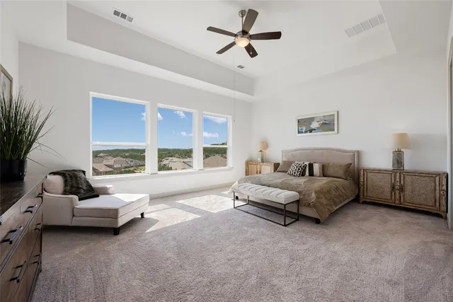 a large kitchen with kitchen island a stove a sink a refrigerator and a wooden floor