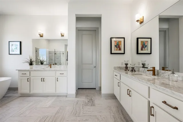 a kitchen with sink stove and wooden floor