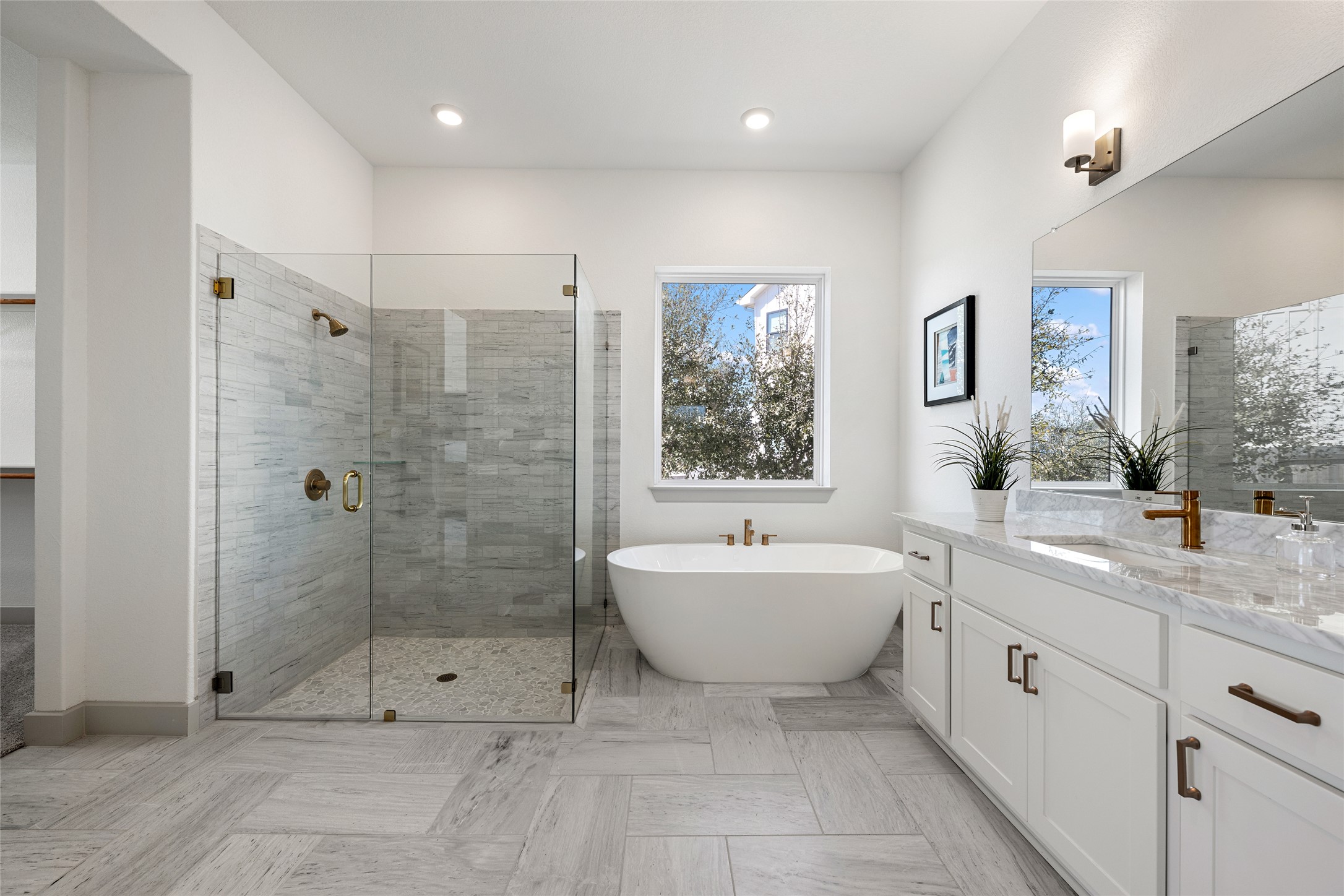 298 Smoke Tree Circle Dripping Springs, TX 78620 - Photo 17 of 38 a spacious bathroom with a shower sink mirror and a bathtub
