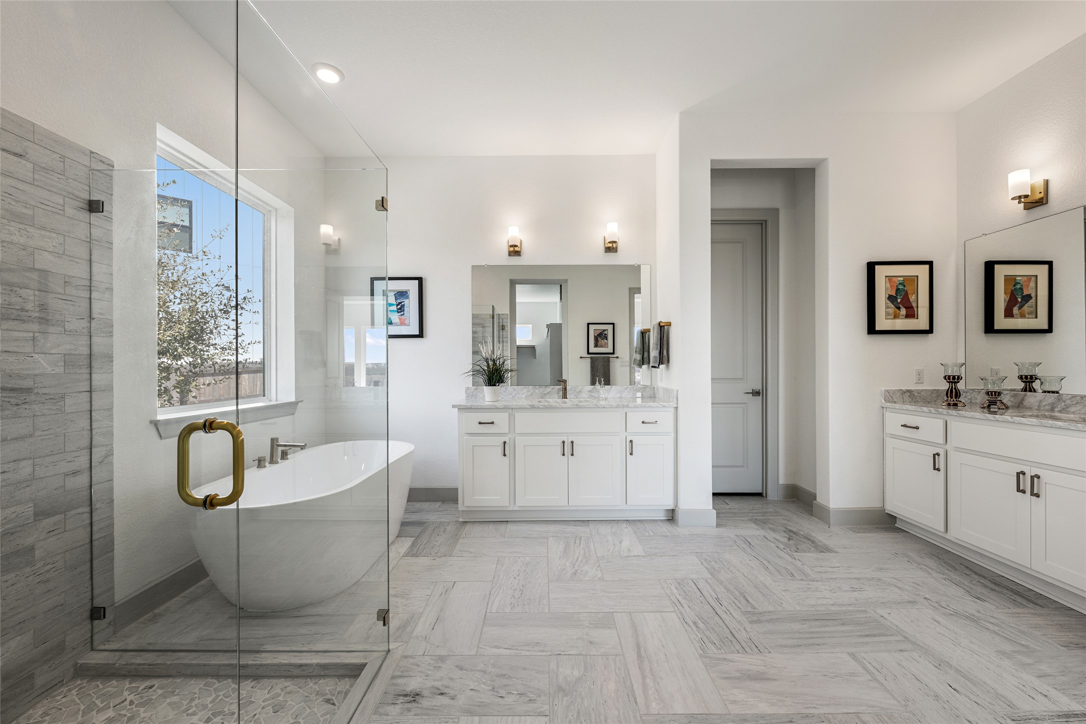 298 Smoke Tree Circle Dripping Springs, TX 78620 - Photo 18 of 38 a spacious bathroom with a double vanity sink a mirror a bathtub and window