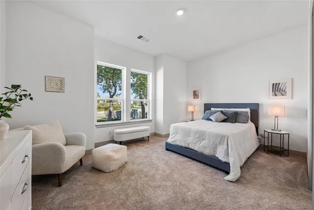 a spacious bathroom with a shower sink mirror and a bathtub