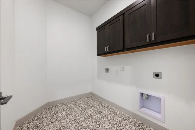 a bedroom with a bed and a couch with exposed radiator