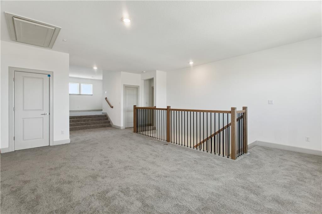 298 Smoke Tree Circle Dripping Springs, TX 78620 - Photo 24 of 38 a view of a hallway