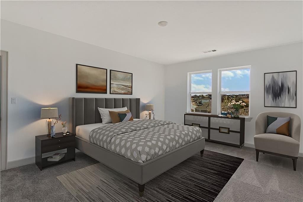 298 Smoke Tree Circle Dripping Springs, TX 78620 - Photo 26 of 38 a bedroom with a bed and couch