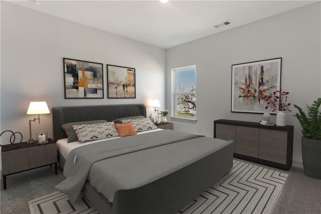 298 Smoke Tree Circle Dripping Springs, TX 78620 - Photo 28 of 38 a bedroom with a bed and a painting on the wall