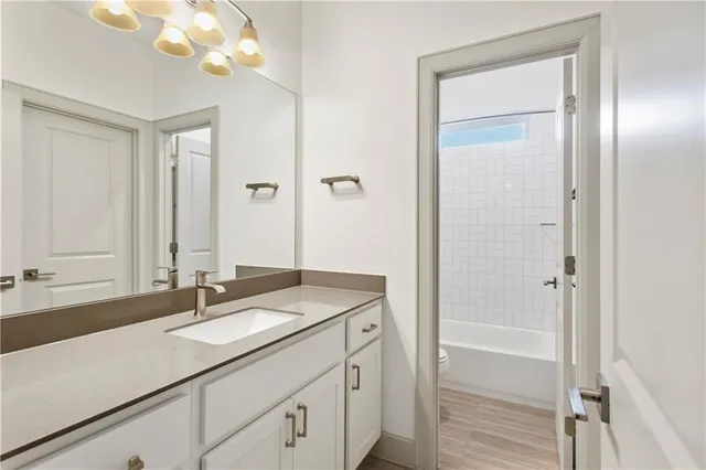 a bedroom with a bed and couch