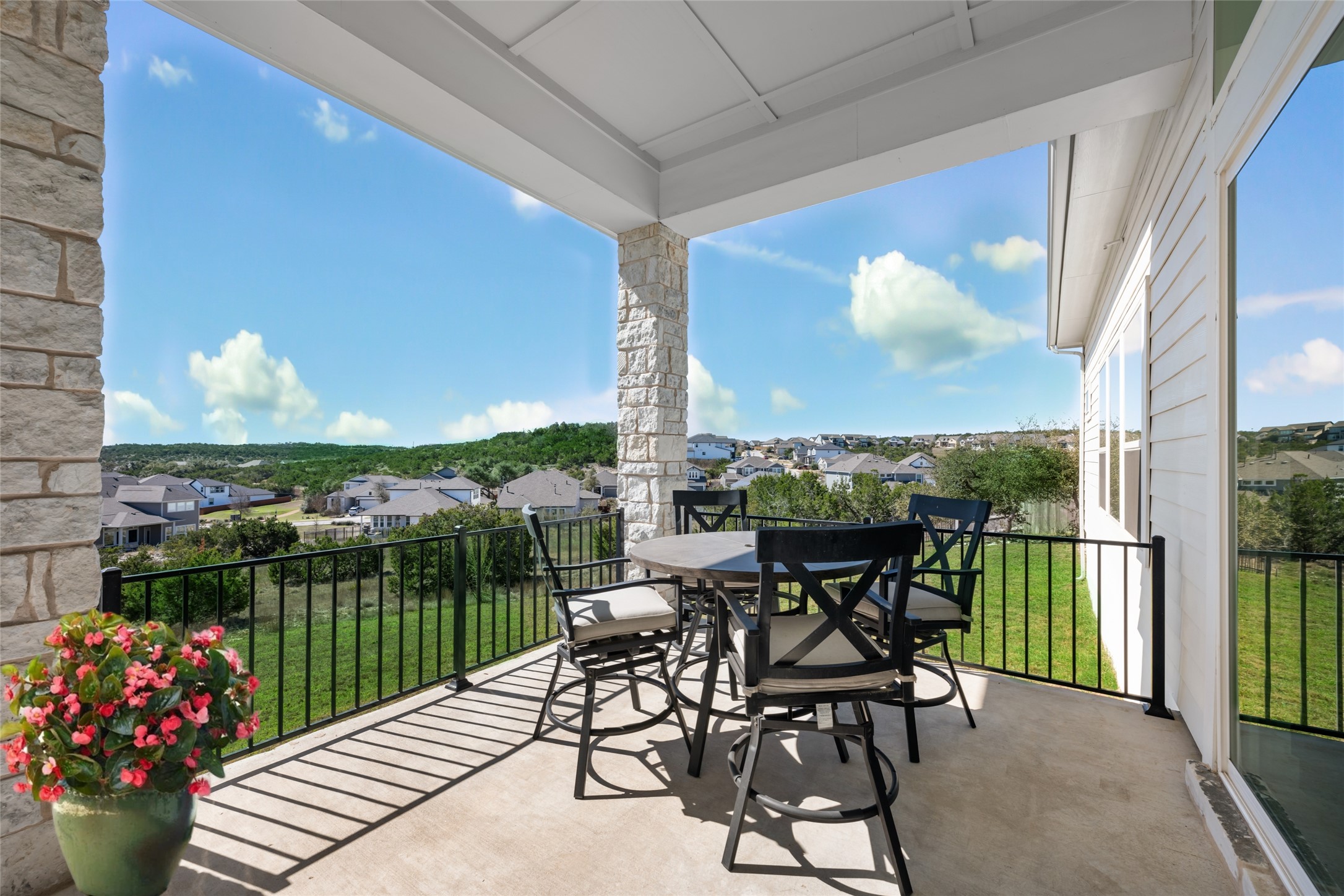 298 Smoke Tree Circle Dripping Springs, TX 78620 - Photo 31 of 38 a view of a chairs and table in patio