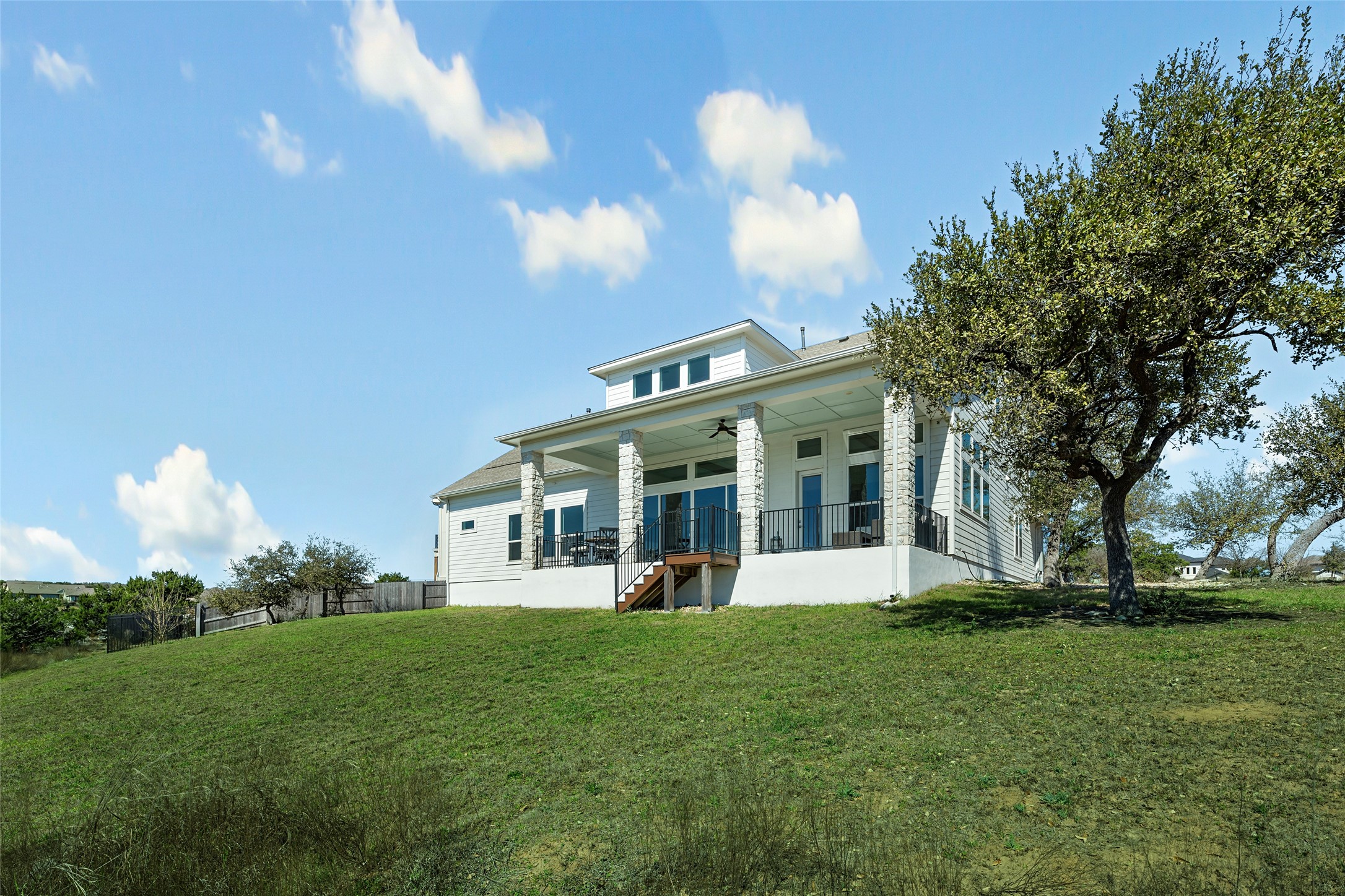 298 Smoke Tree Circle Dripping Springs, TX 78620 - Photo 33 of 38 a view of a house with a yard and potted plants