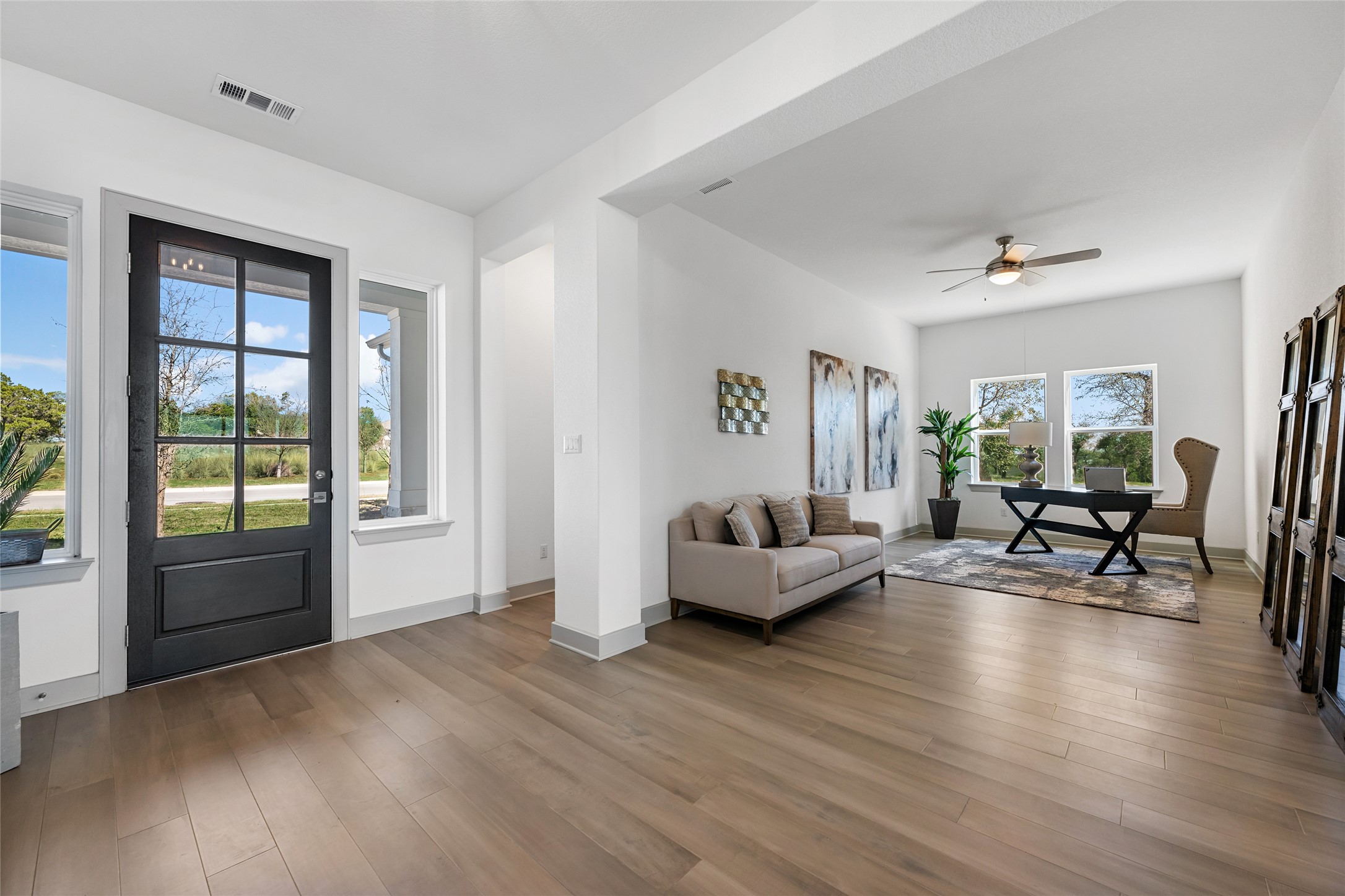 298 Smoke Tree Circle Dripping Springs, TX 78620 - Photo 5 of 38 a living room with furniture and a large window