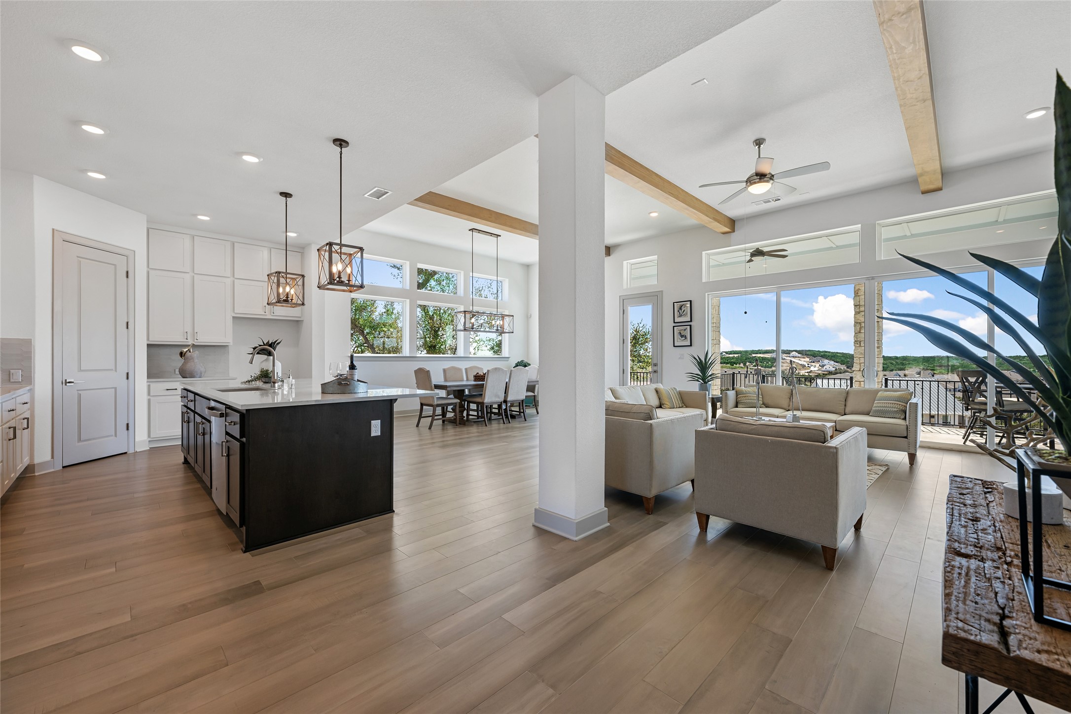 298 Smoke Tree Circle Dripping Springs, TX 78620 - Photo 36 of 38 a kitchen with lots of counter top space and living room