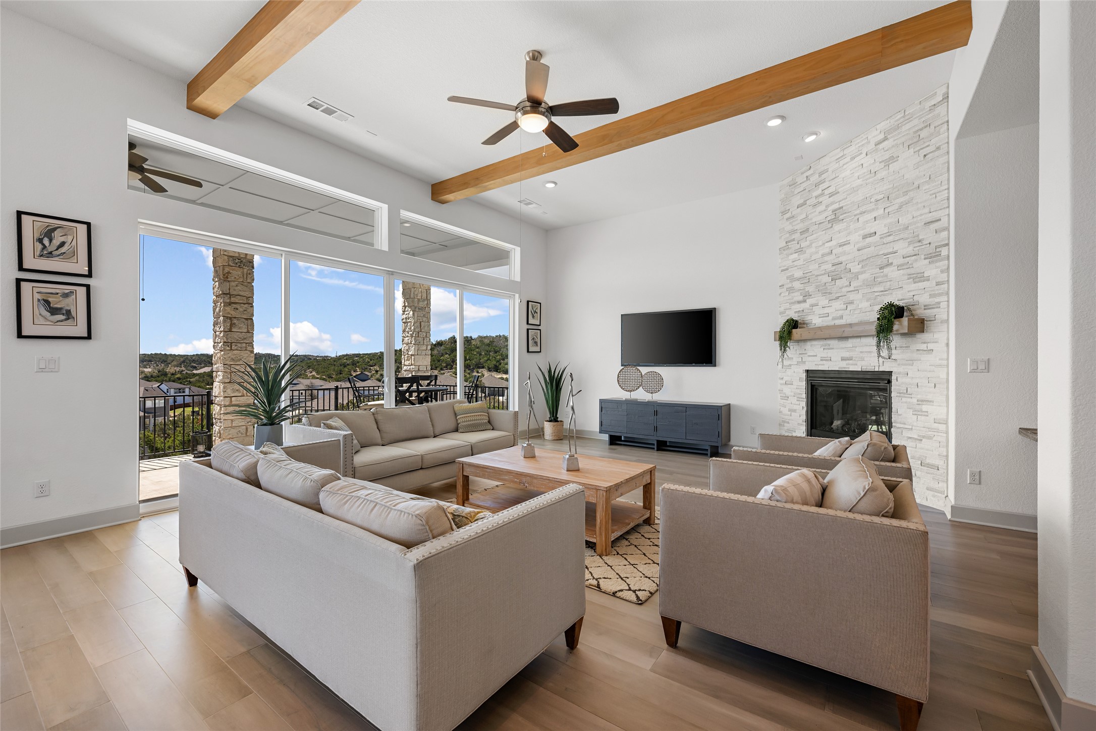 298 Smoke Tree Circle Dripping Springs, TX 78620 - Photo 8 of 38 a living room with fireplace furniture and a flat screen tv