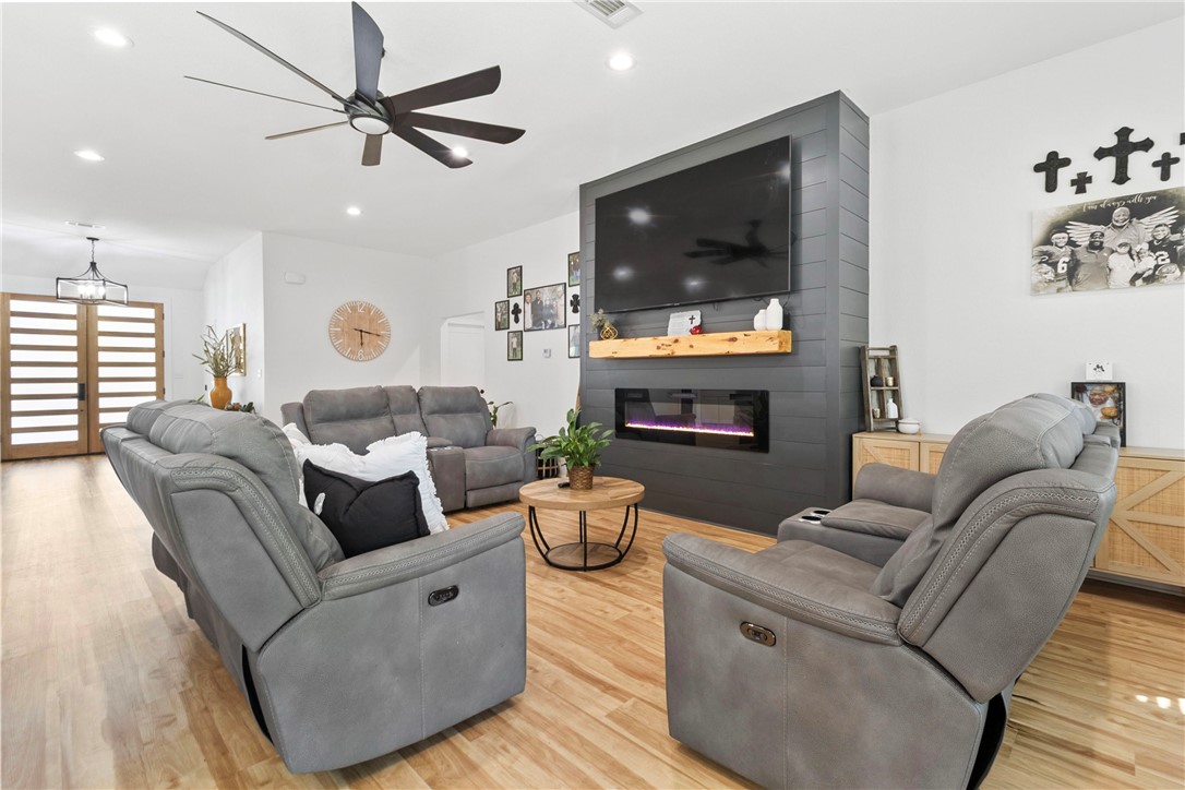 906 3rd Street Valley Mills, TX 76689 - Photo 11 of 52 a living room with furniture and a flat screen tv