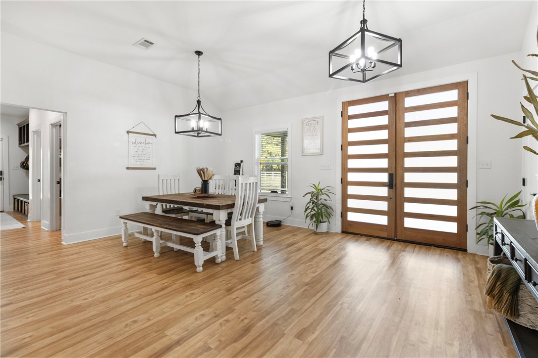 906 3rd Street Valley Mills, TX 76689 - Photo 12 of 52 a room with wooden floor and window