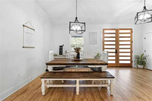 a view of a livingroom with furniture window and wooden floor