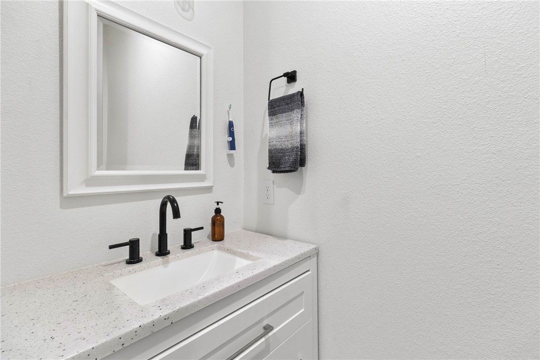 906 3rd Street Valley Mills, TX 76689 - Photo 39 of 52 a bathroom with a sink and a mirror