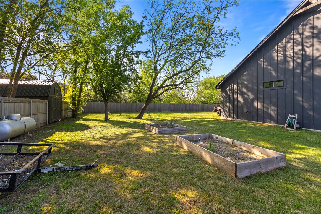 906 3rd Street Valley Mills, TX 76689 - Photo 44 of 52 a view of a backyard with a garden