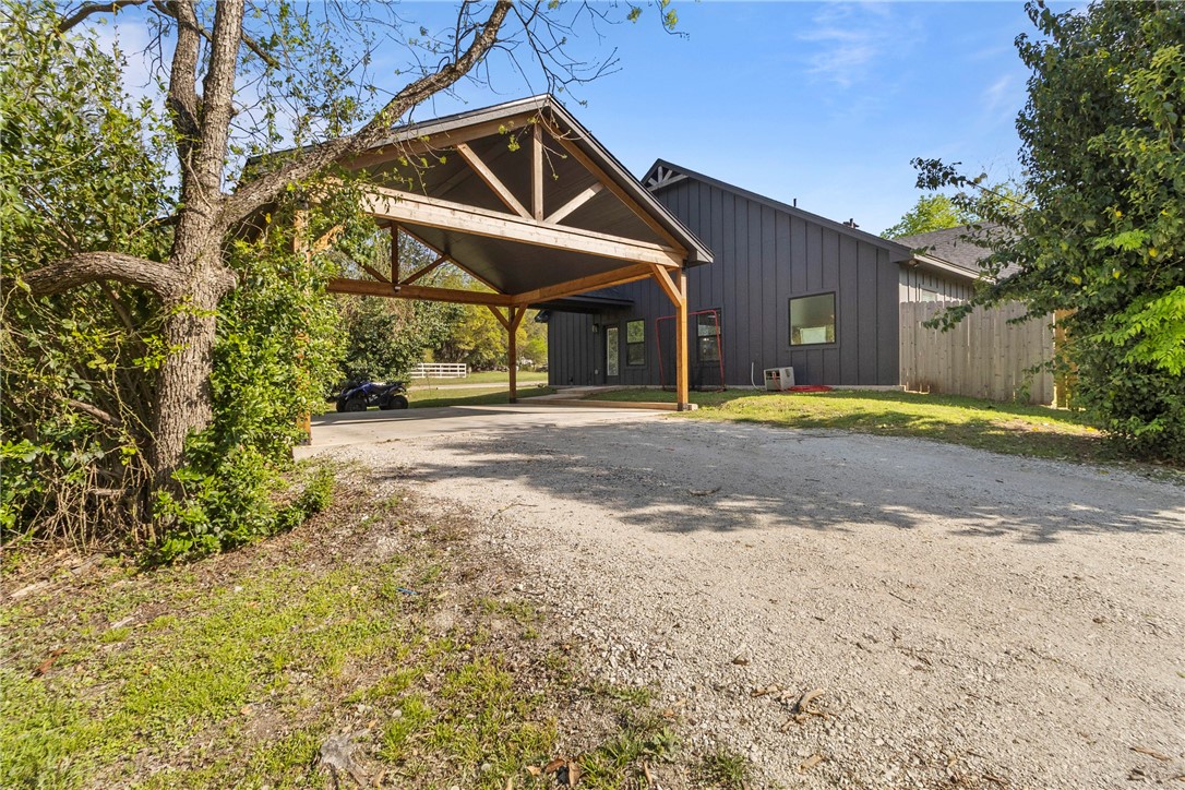 906 3rd Street Valley Mills, TX 76689 - Photo 5 of 52 a front view of a house with a yard and garage
