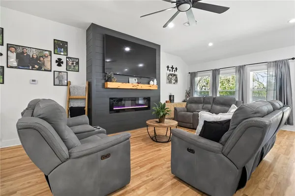 a living room with furniture and a flat screen tv