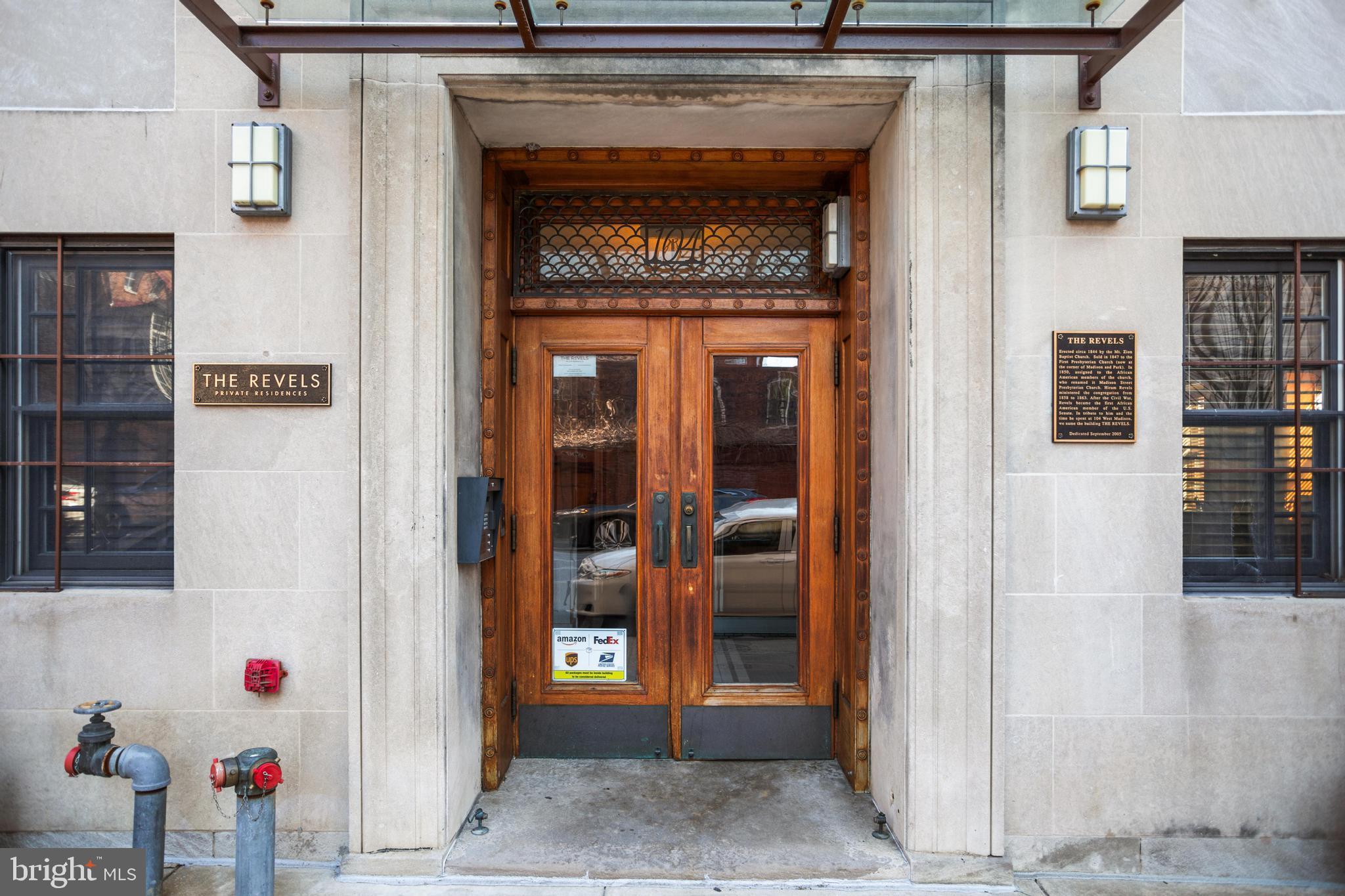 104 West Madison Street, Unit 6 Baltimore, MD 21201 - Photo 3 of 4 a front view of a house with entryway