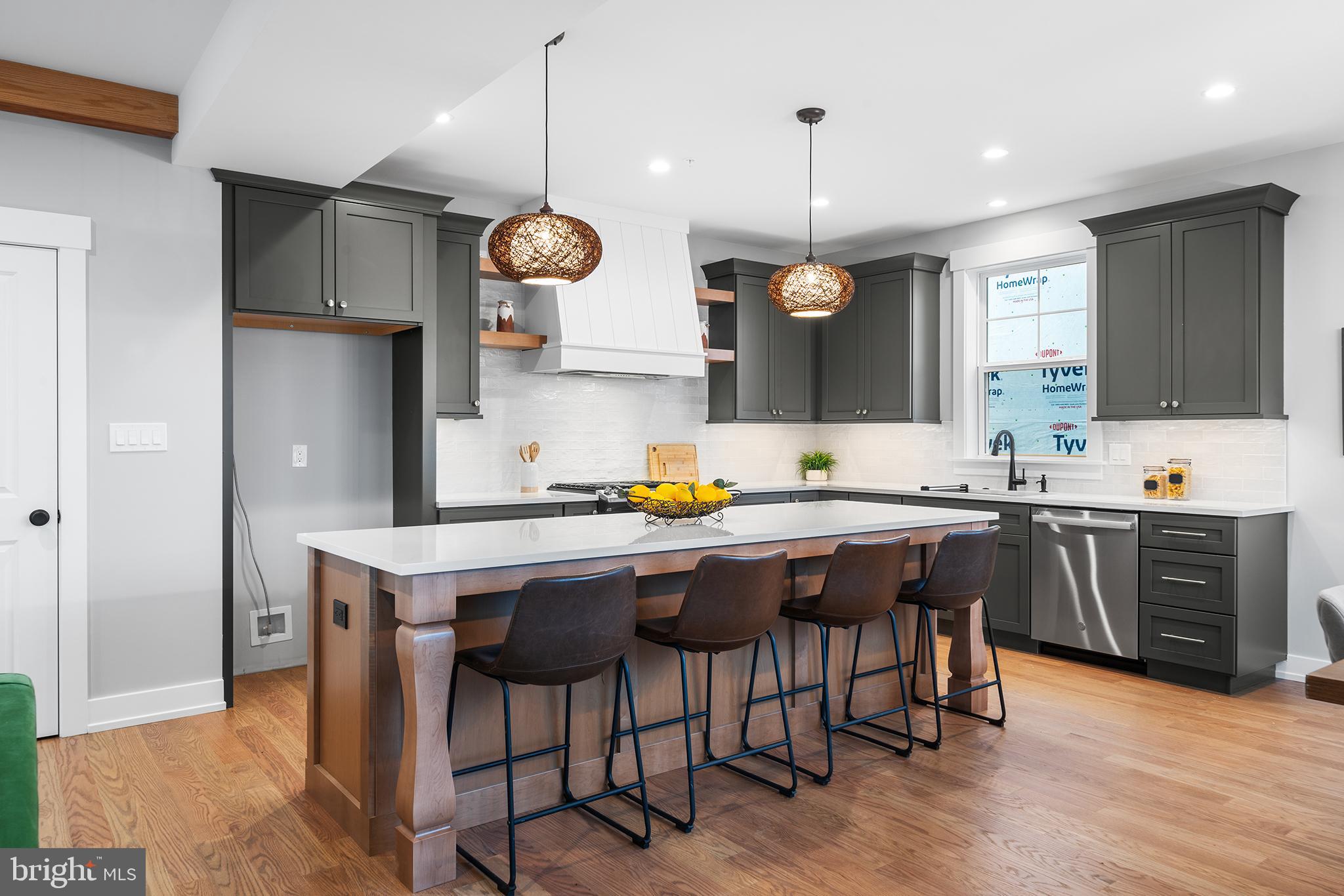218 Hendricks Avenue Exton, PA 19341 - Photo 12 of 33 a kitchen with a sink a center island stainless steel appliances and cabinets