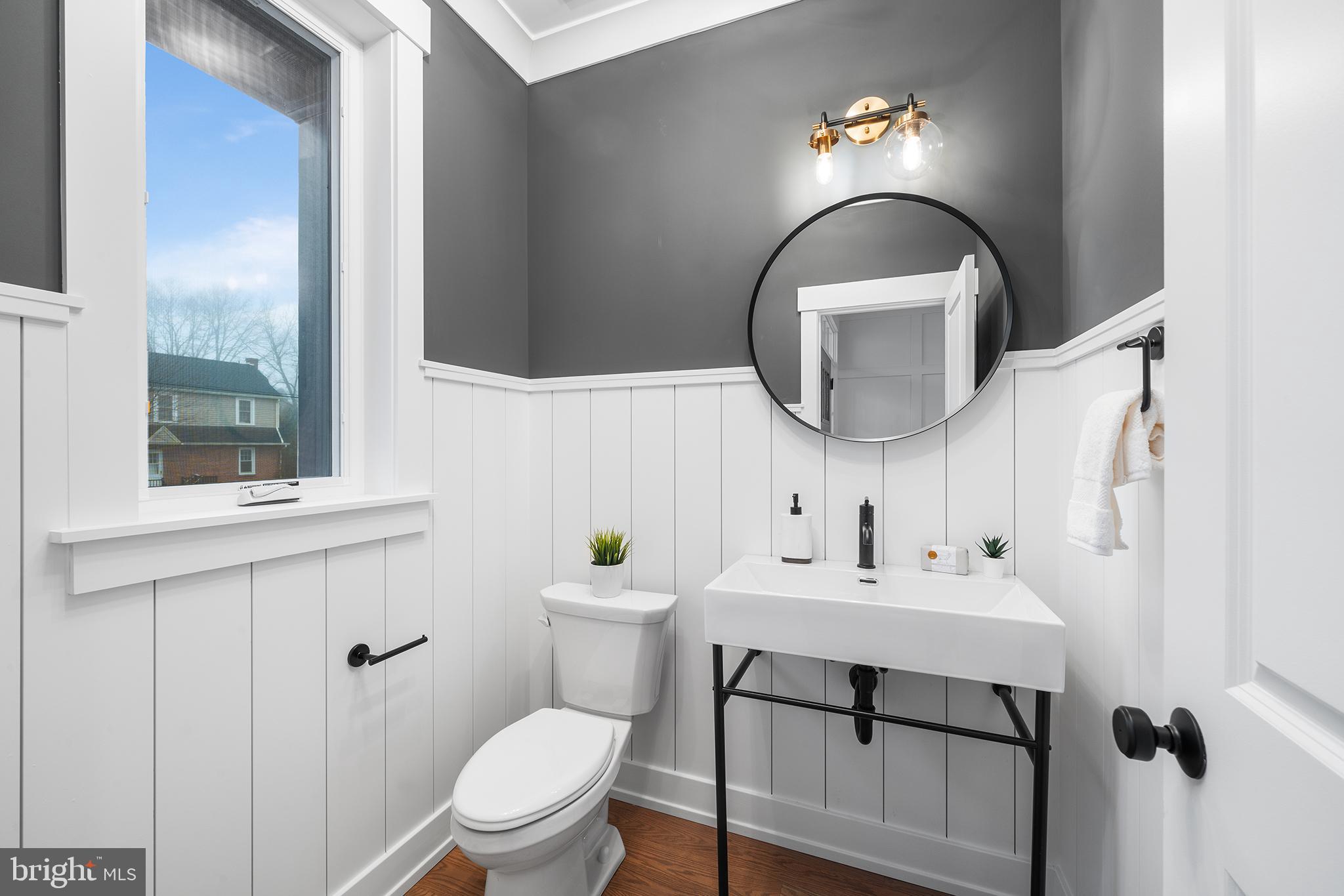 218 Hendricks Avenue Exton, PA 19341 - Photo 14 of 33 a bathroom with a sink a toilet and a mirror