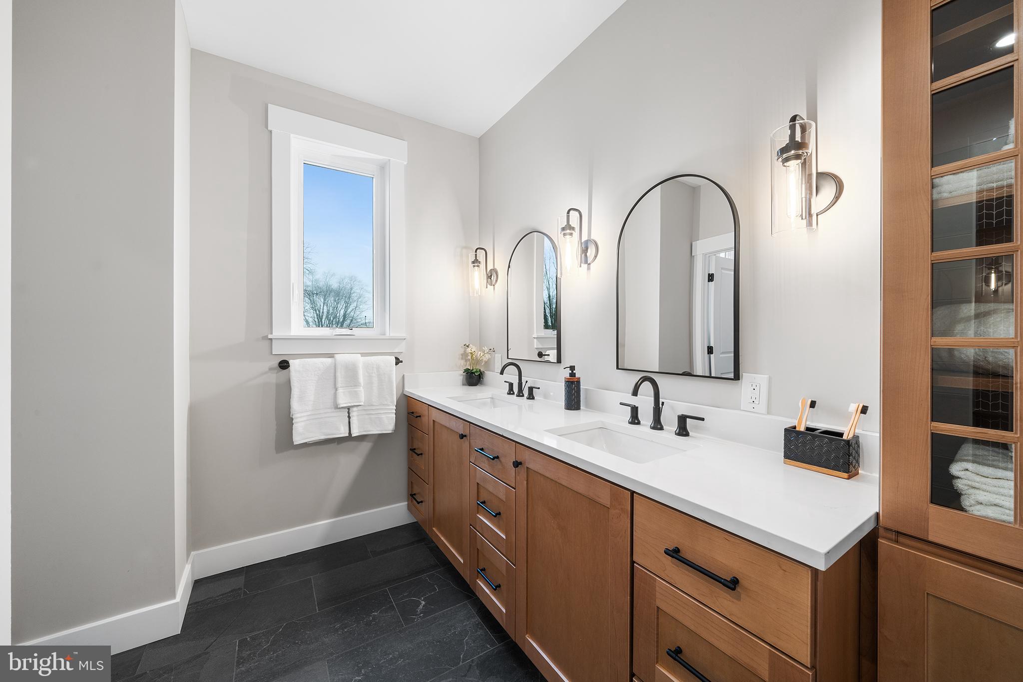 218 Hendricks Avenue Exton, PA 19341 - Photo 22 of 33 a bathroom with 2 sink and a mirror