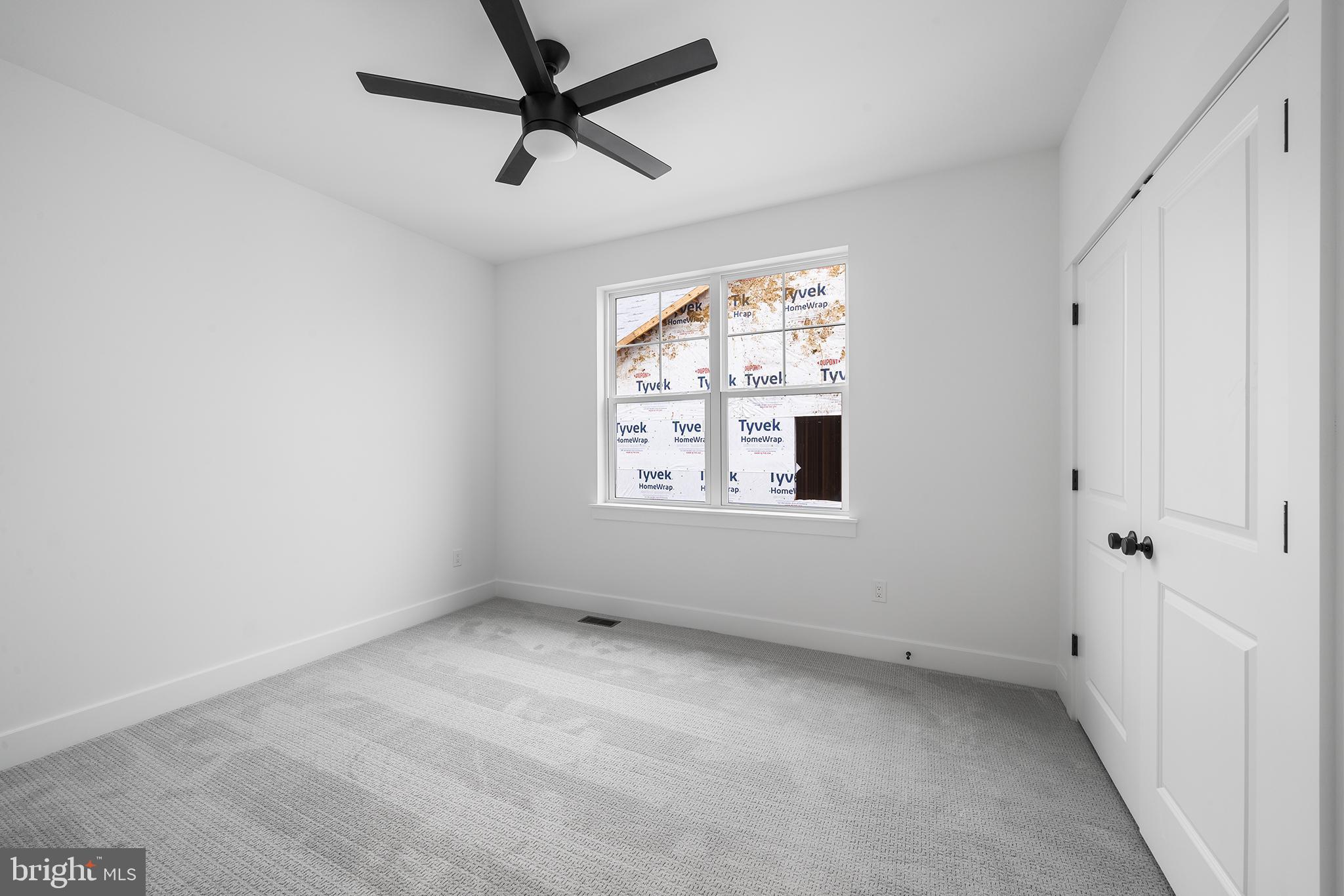 218 Hendricks Avenue Exton, PA 19341 - Photo 28 of 33 an empty room with a window and a fan
